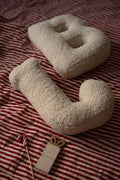 Boucle Letter Cushion B and J Teddy Letter Pillow by Bettys Home lying on bed as bedroom decoration idea 