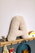 Boucle letter cushion A teddy pillow by bettys home standing in baby room next to maileg mouse as kids room decorations 