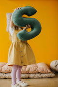 little girl with velvet letter cushion s in mint by Bettys home presents a gift