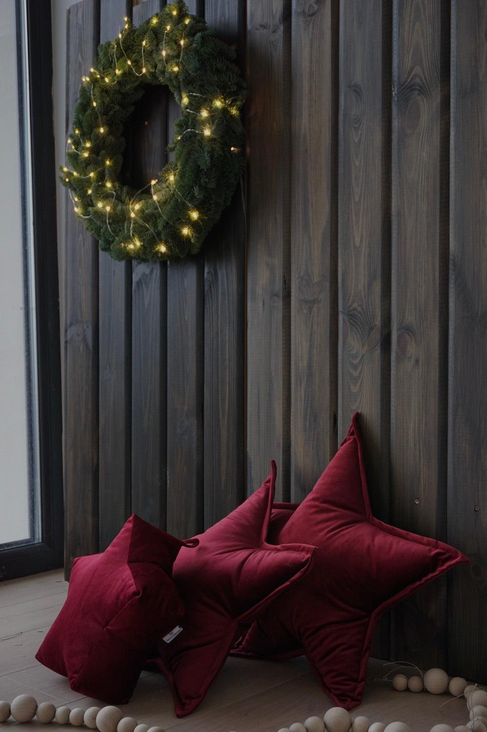 velvet star cushion wine red by bettys home with small star cushion in wine red on wooden wall