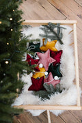 velvet little star pendant yellow with pompoms by bettys home in christmas trolley next to christmas tree